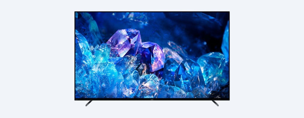 Телевизор BRAVIA A80K с подставкой и изображением синих и фиолетовых кристаллов на экране, вид спереди
