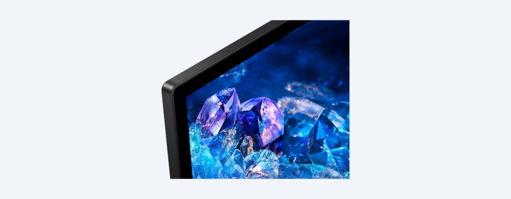 Телевизор BRAVIA A80K с изображением синих и фиолетовых кристаллов на экране, крупный план корпуса