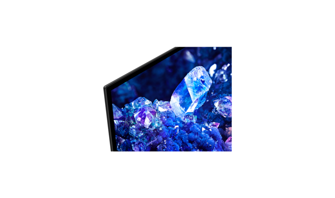 Крупный план на рамке телевизора с изображением синих и фиолетовых кристаллов на экране