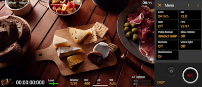 Снимок экрана Xperia, демонстрирующий интерфейс Videography Pro, а также изображение сырной доски и других блюд на столе